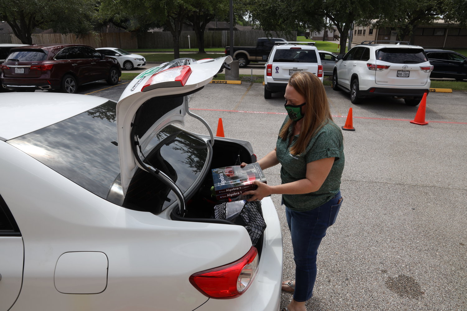 Device pickups were no contact to ensure the safety of the volunteers and families. Distributors would put the devices and hotspots in the trunk of the car, and then talk to the parents on how to use them.